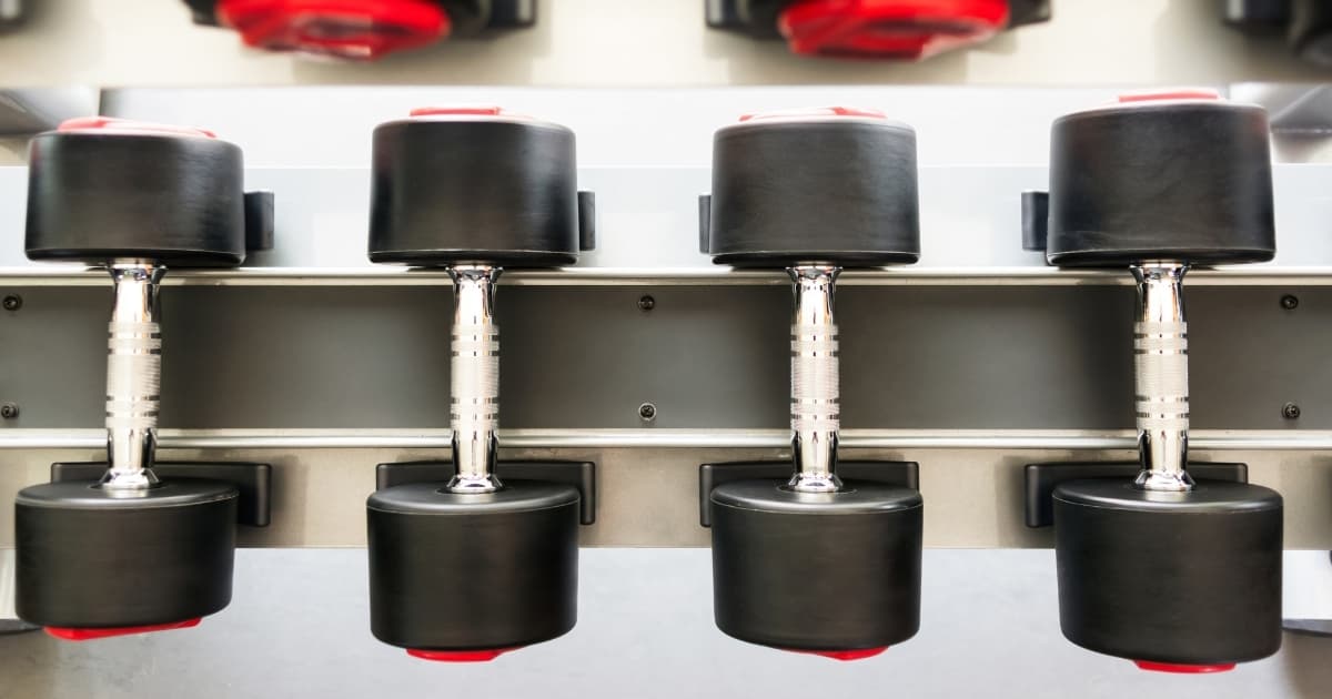 A rack of adjustable dumbbells for strength training